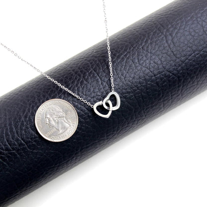 Here’s a revised version:  "Personalized Custom Engraved Interlocking Heart Necklace Featuring Two Names – Double Love Pendant Choker for Collarbone"